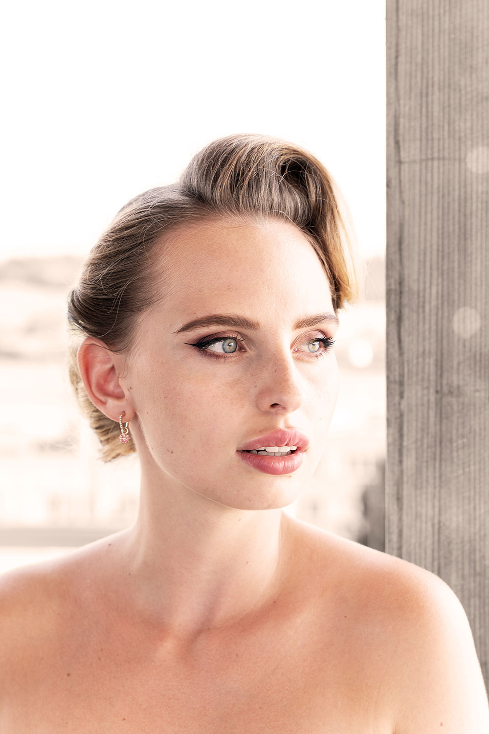 A beautiful women looking outside.